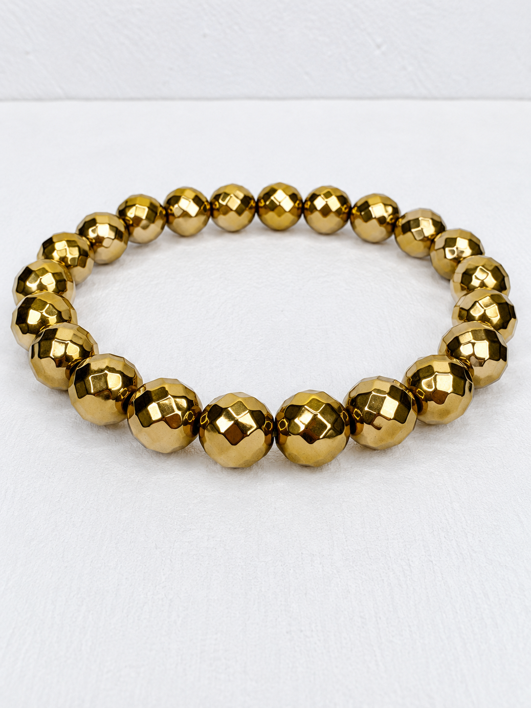 Faceted Gold Aura Coated Hematite Bracelet – 8mm